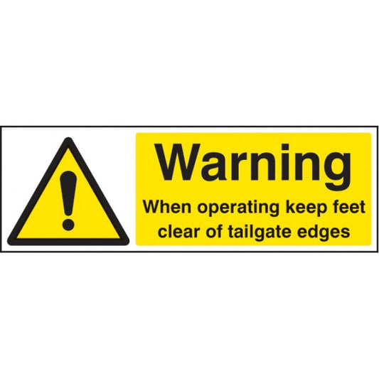Warning when operating keep feet clear of tailgate edges (4254)